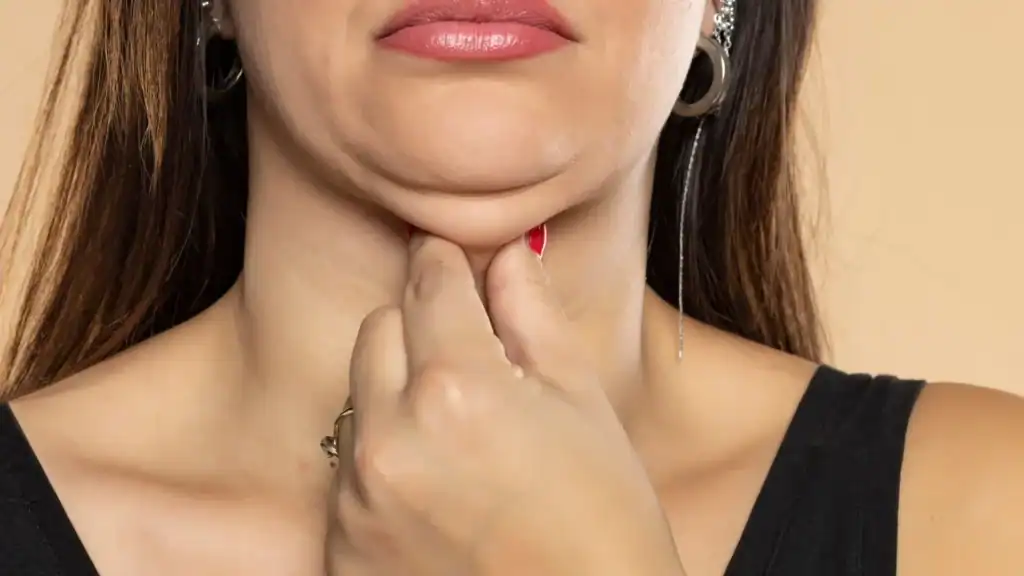 An image of a woman with double chin, sad, worried : Non Surgical Double Chin Removal Treatment in Surrey, UK